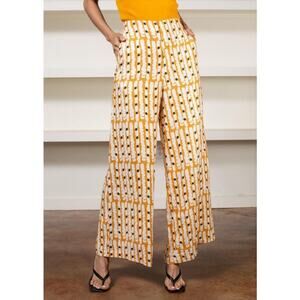 lanhtropy orange linen patterned wide leg trousers